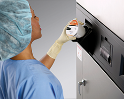 SPD Technician using V-PRO VHP Low Temp Sterilizer