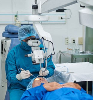 Surgeon using Ophthalmic Instruments on Patient