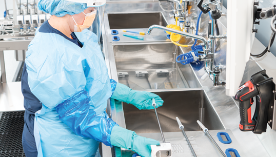 Technician using Reprocessing Sink for Robotic Instruments