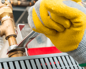 Technician working to conduct preventive maintenance.